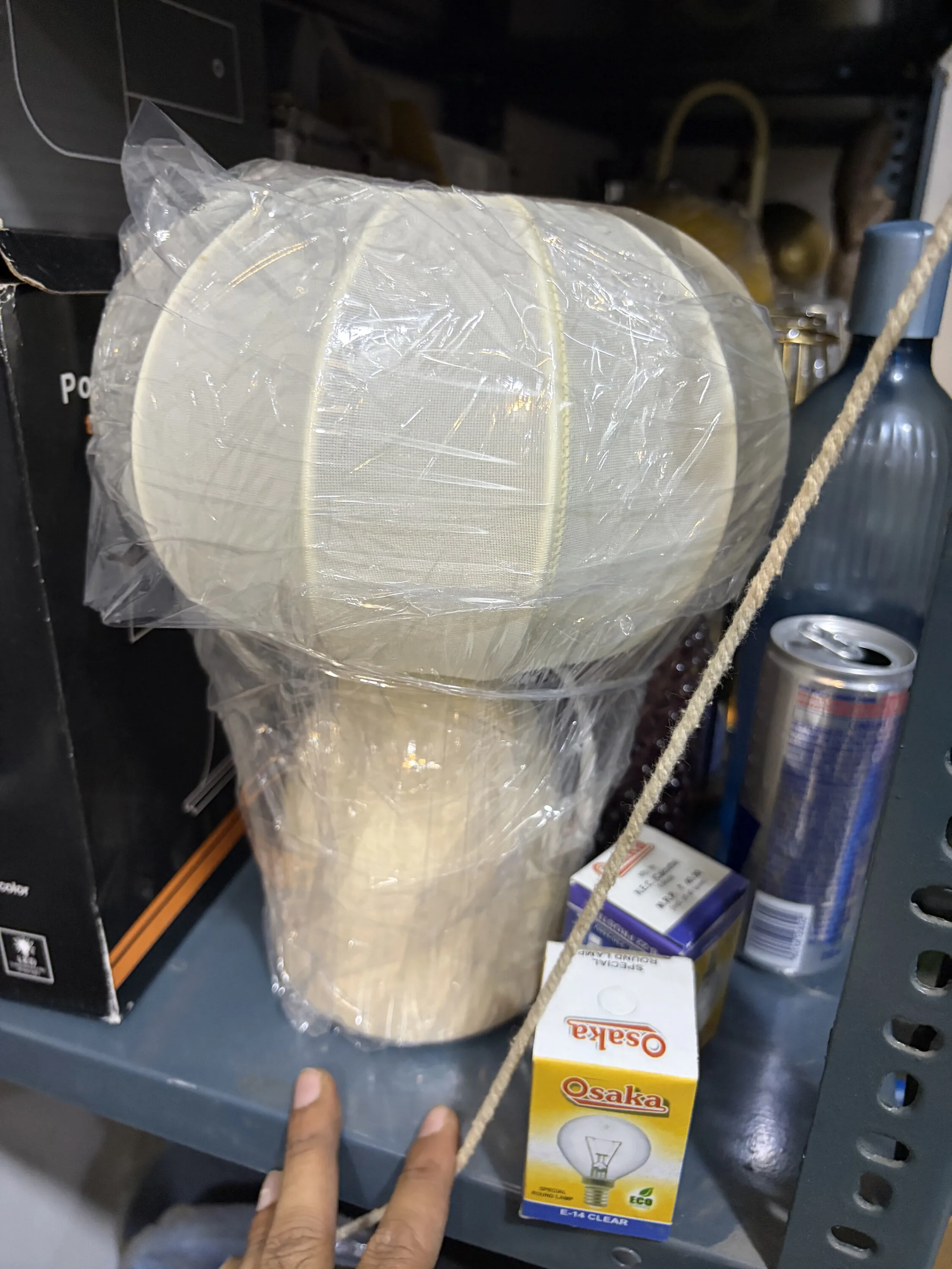 Cream Fabric Dome Table Lamp in Plastic Wrap — Lighting prop for rent in Delhi NCR