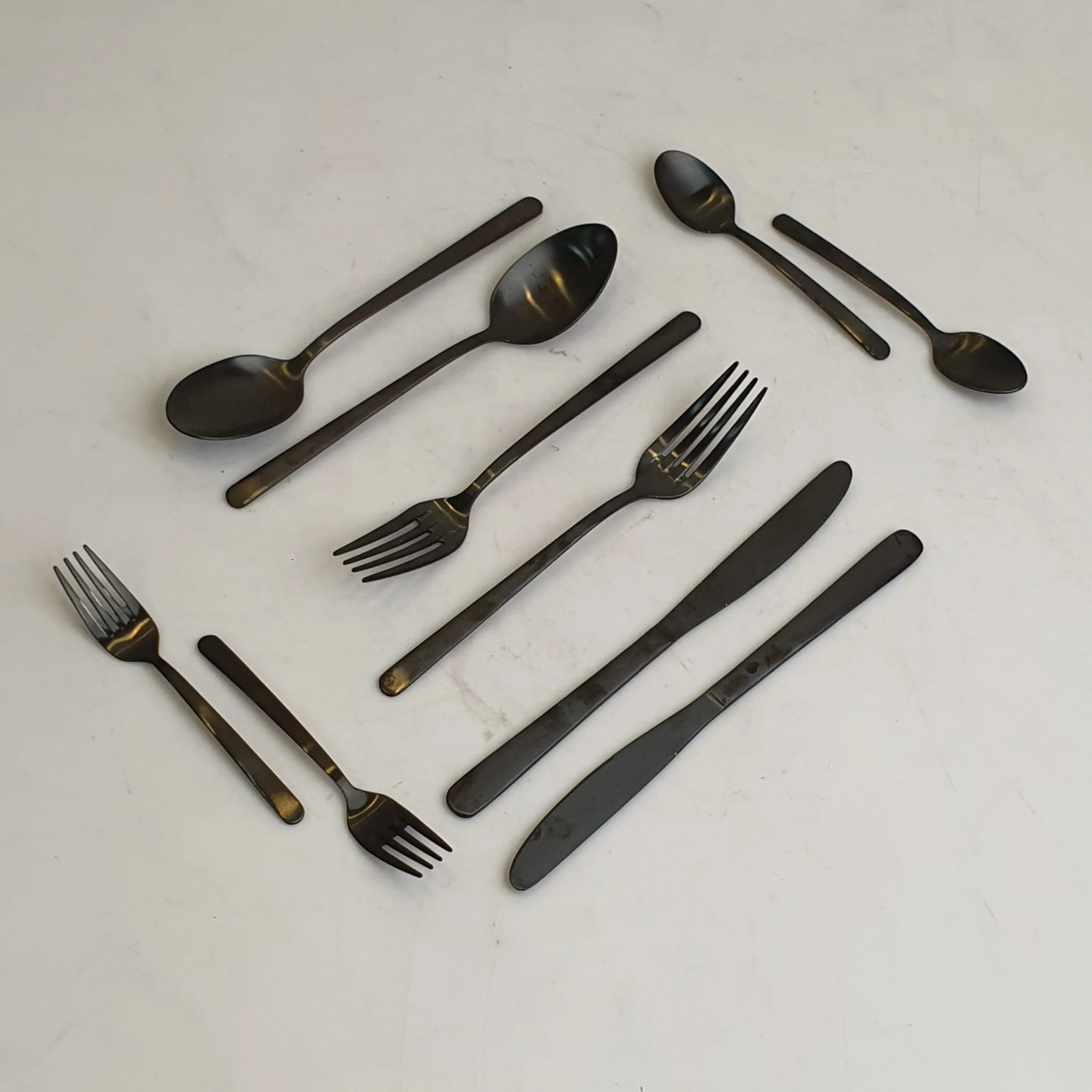 Matte Black Steel Cutlery Set Spoons Forks Knives — Kitchen and Dining prop for rent in Delhi NCR