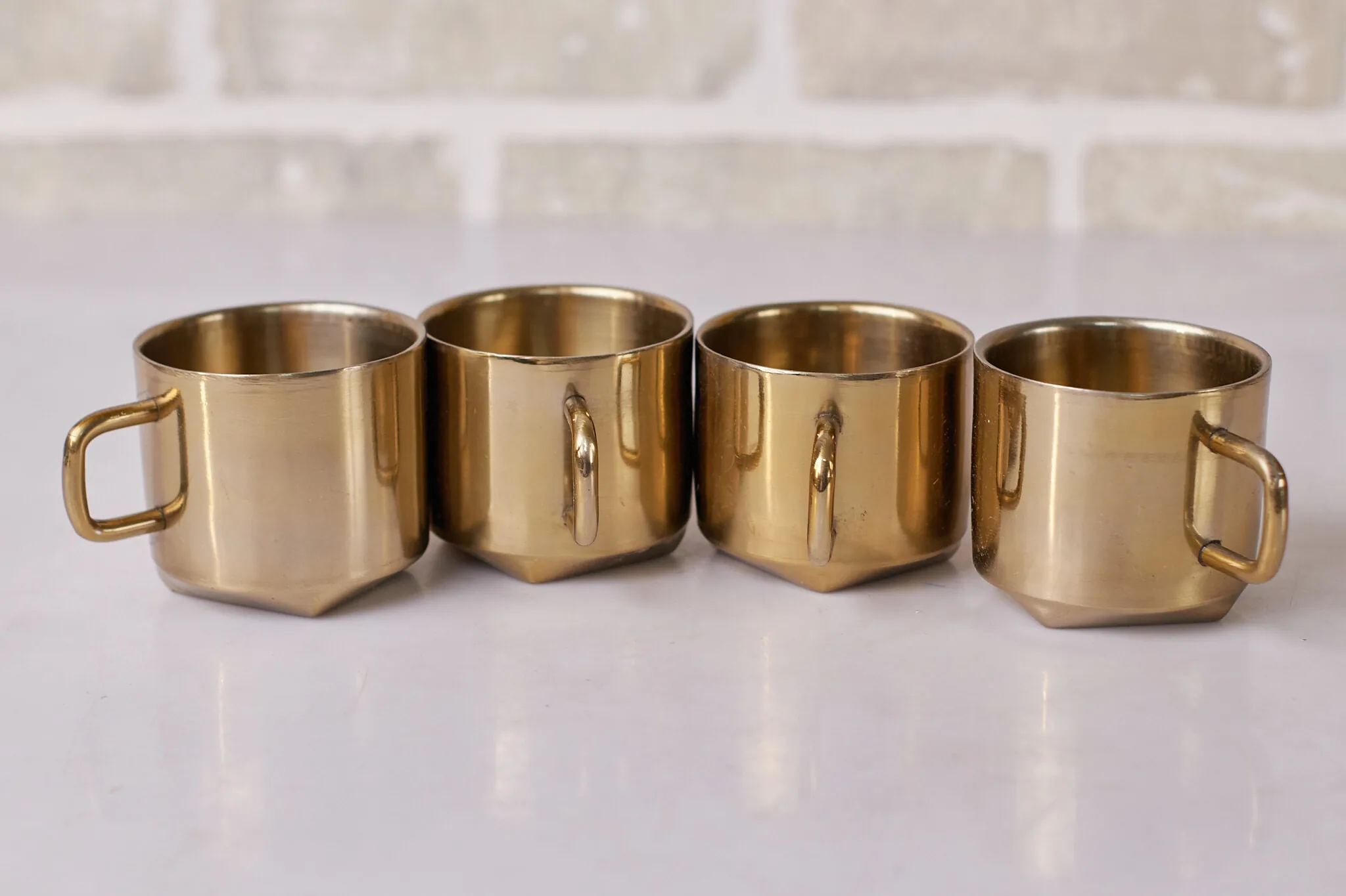 Gold Brass Faceted Mugs Set Of Four — Kitchen and Dining prop for rent in Delhi NCR
