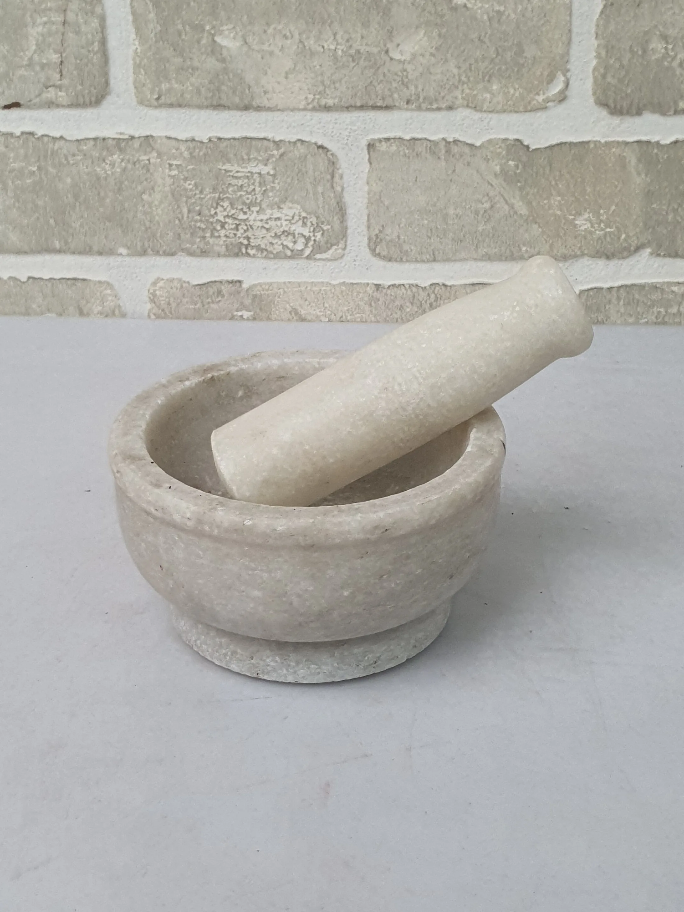 White Marble Mortar and Pestle Set — Kitchen and Dining prop for rent in Delhi NCR