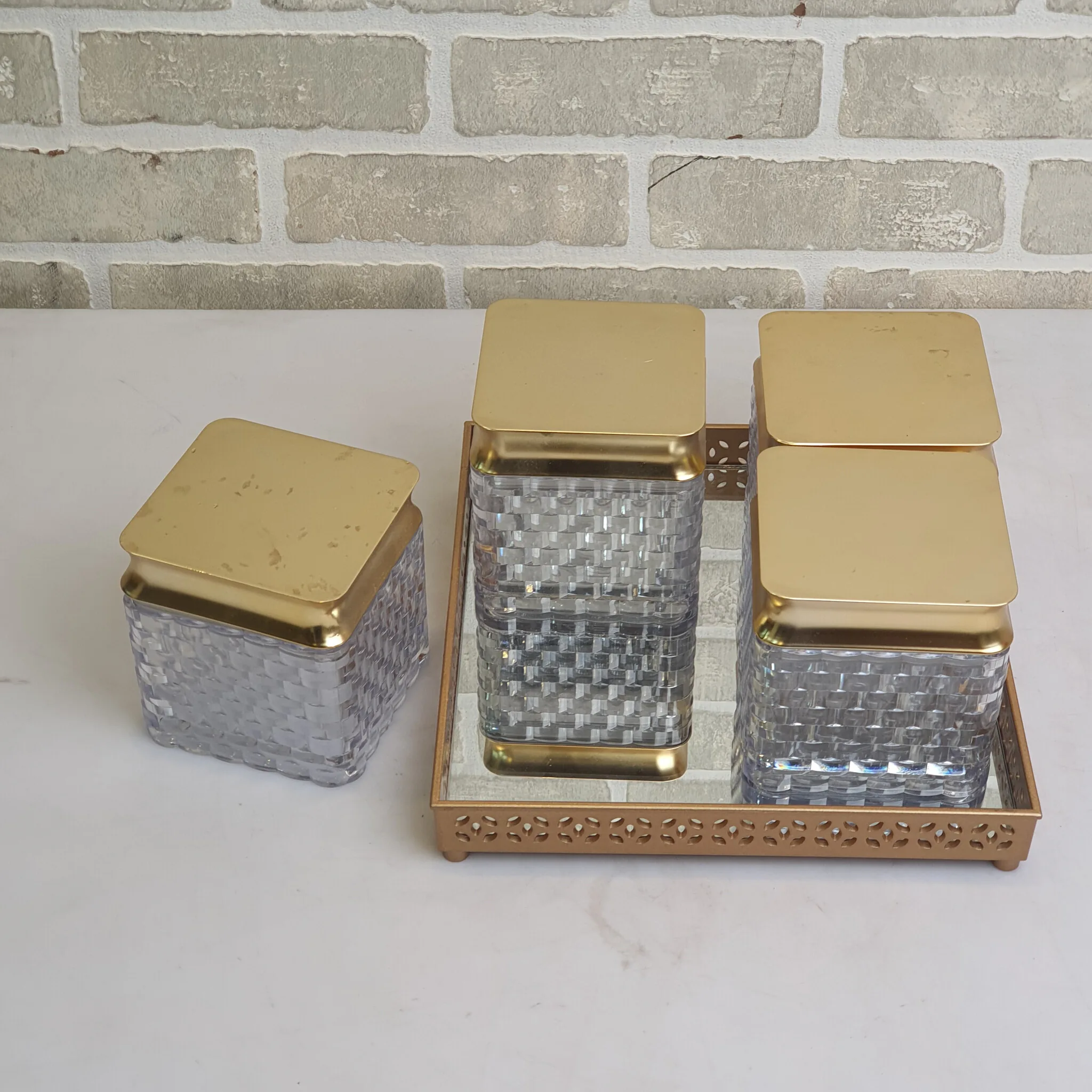Clear Glass Jars With Gold Lids On Gold Tray — Kitchen and Dining prop for rent in Delhi NCR