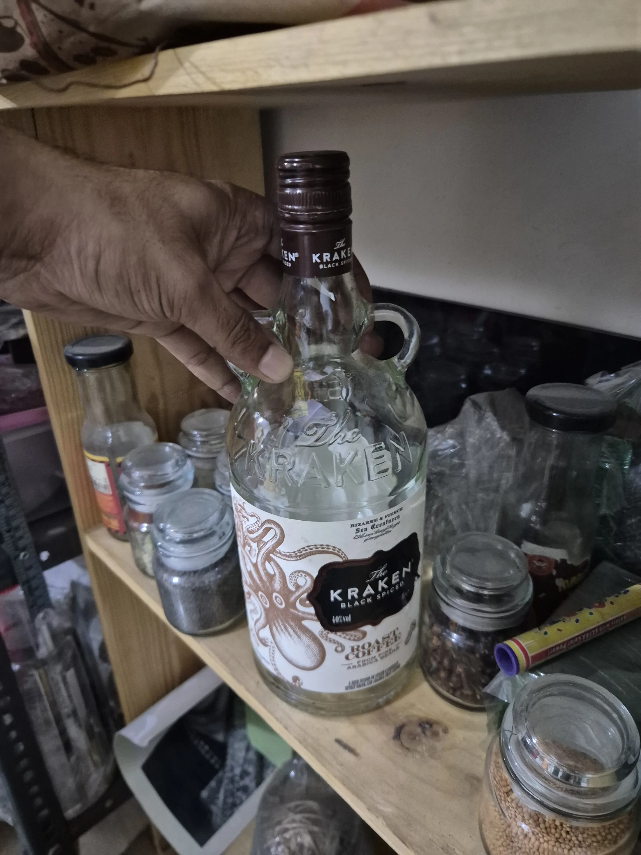 Clear Glass Spirit Bottle with Octopus Label — Bar and Glassware prop for rent in Delhi NCR