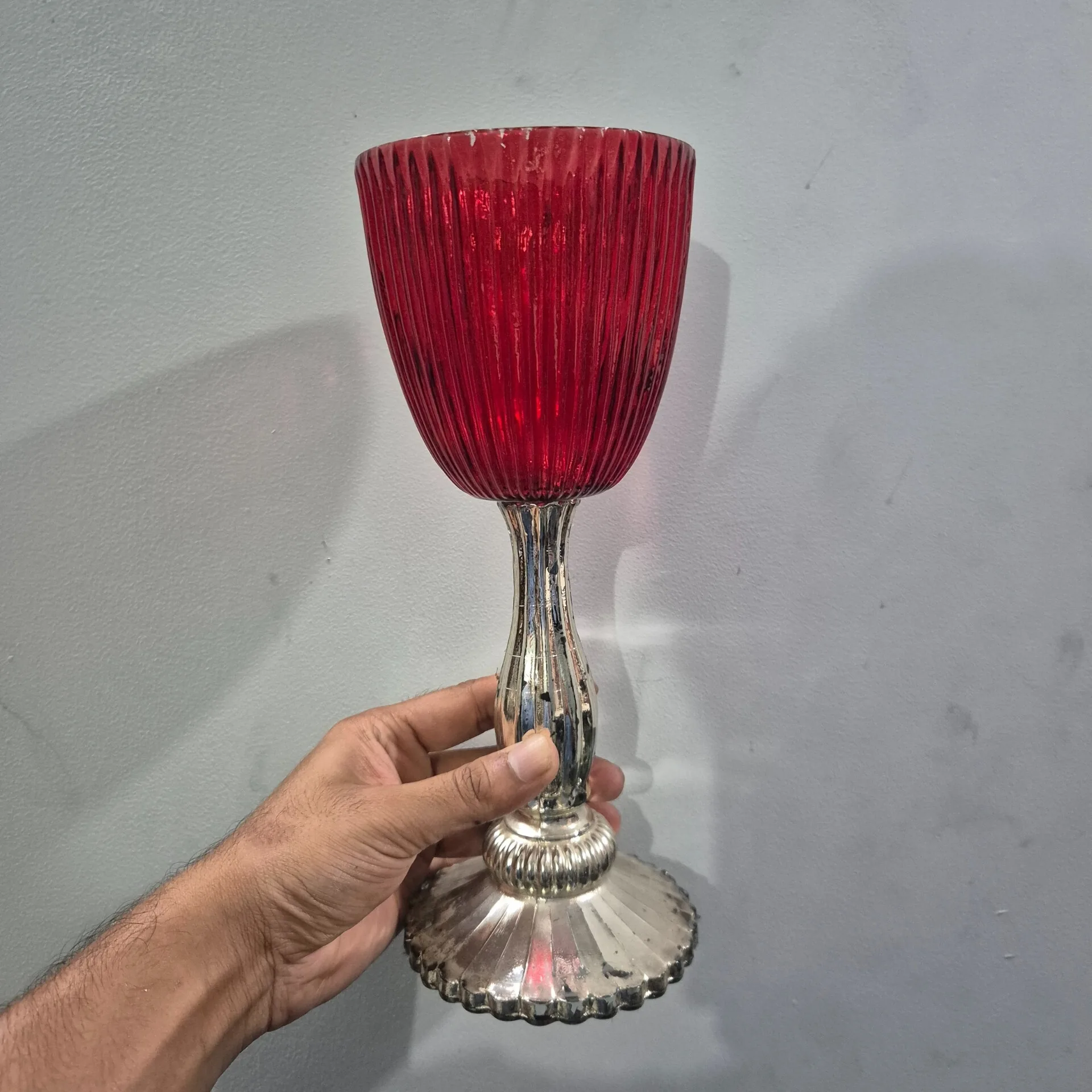 Red Ribbed Glass Candle Holder On Silver Stem — Home Decor prop for rent in Delhi NCR