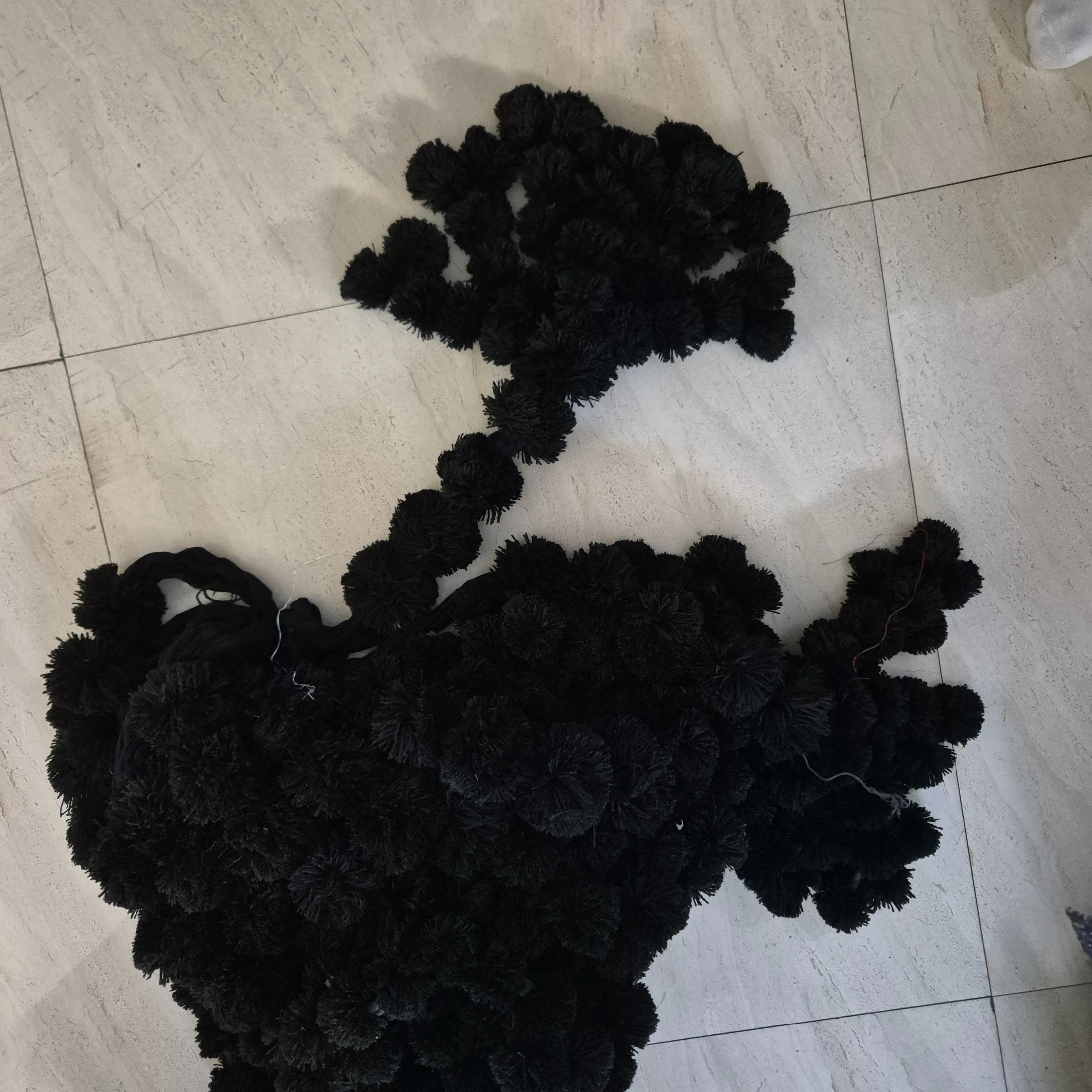 Black Yarn Pom Pom Garland Strands — Wall Decor and Art prop for rent in Delhi NCR