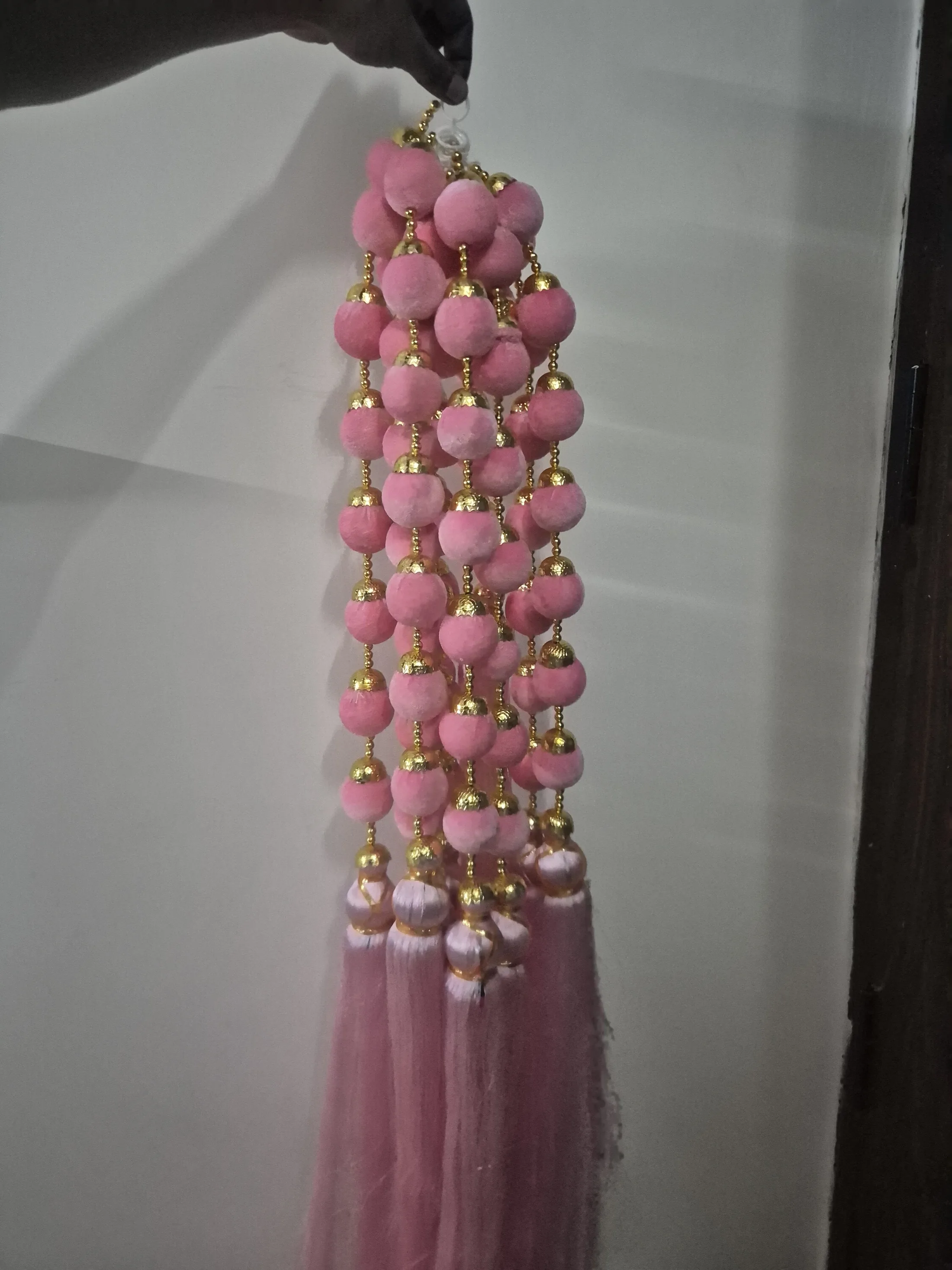Pink Pom Pom Hanging with Gold Beads and Tassels — Wall Decor and Art prop for rent in Delhi NCR