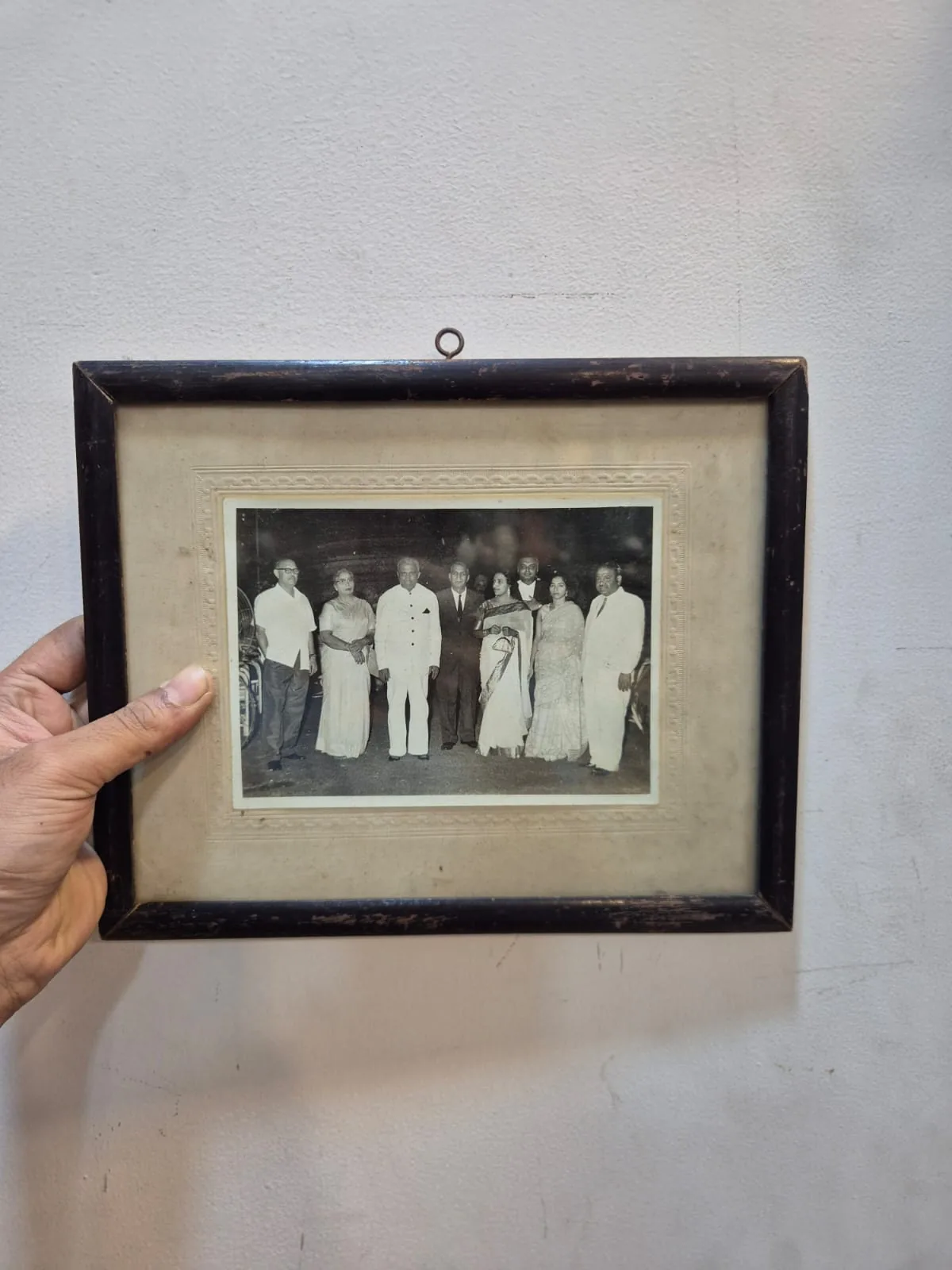 Vintage BW Group Family Photo Dark Wooden Carved Frame — Wall Decor and Art prop for rent in Delhi NCR