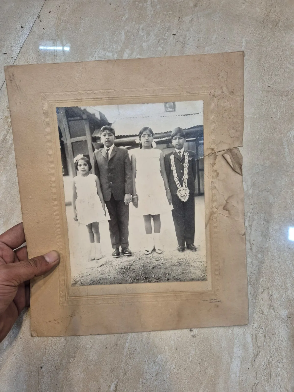 Vintage Sepia Four Children Formal Group Printed Photograph — Wall Decor and Art prop for rent in Delhi NCR