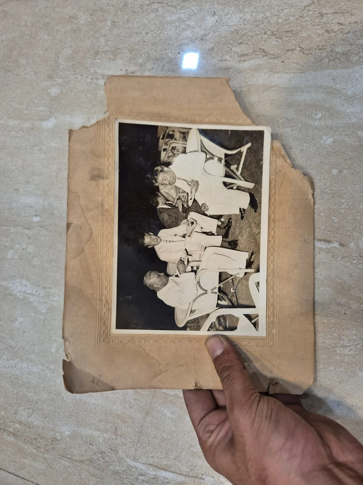 Vintage Sepia Three Men Seated Chairs Printed Photograph — Wall Decor and Art prop for rent in Delhi NCR
