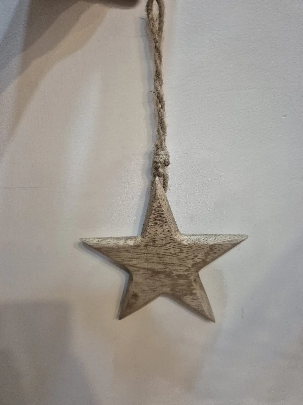 Carved Wooden Star Hanging Ornament on Jute — Wall Decor and Art prop for rent in Delhi NCR