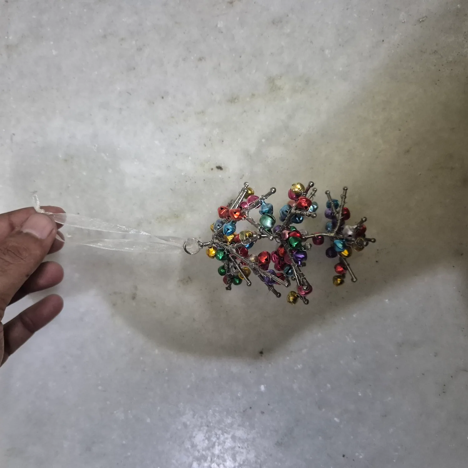 Multicolor Beaded Wire Hanging Ornament With Small Bells — Wall Decor and Art prop for rent in Delhi NCR