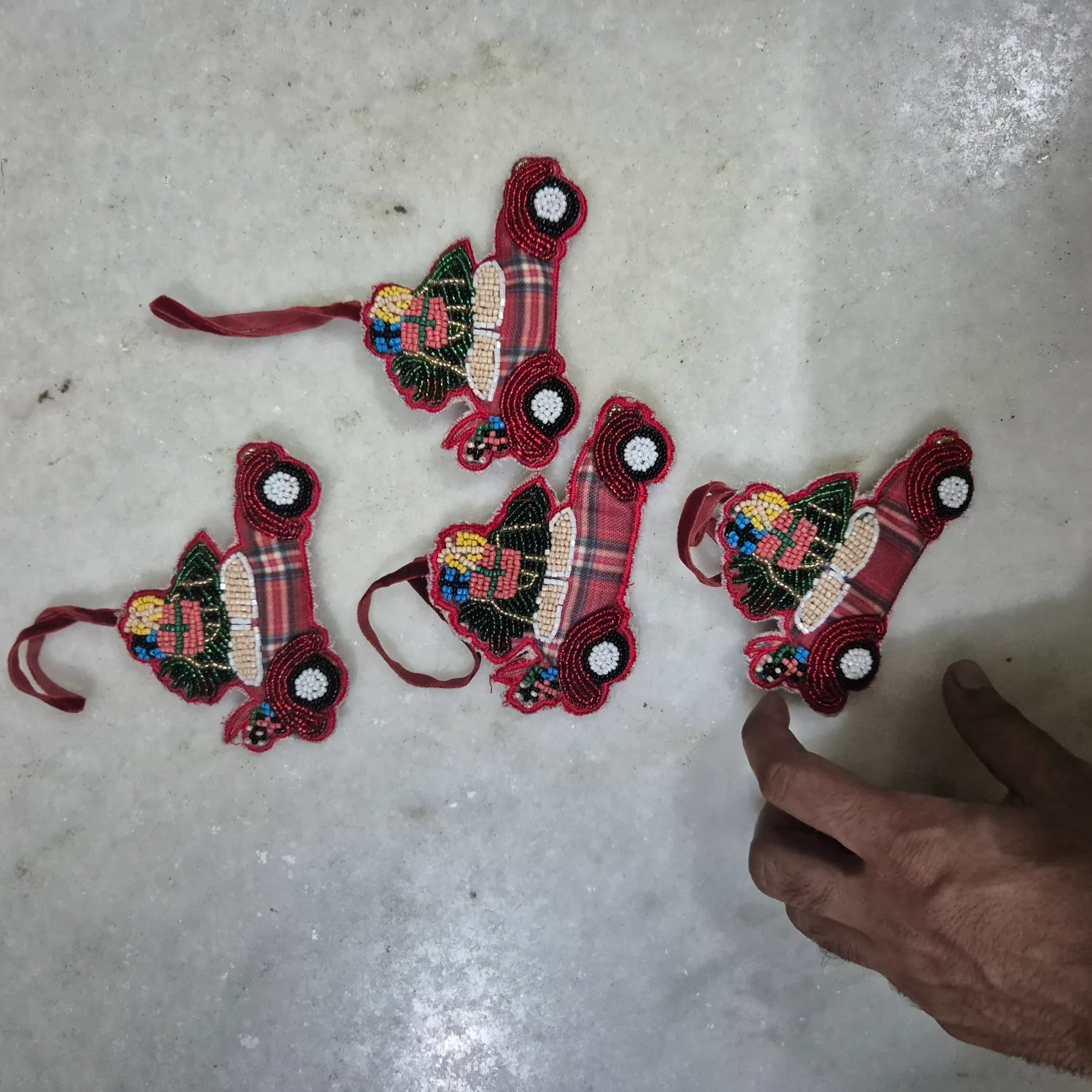 Set Of Beaded Vintage Car Ornaments With Tartan Rider — Wall Decor and Art prop for rent in Delhi NCR