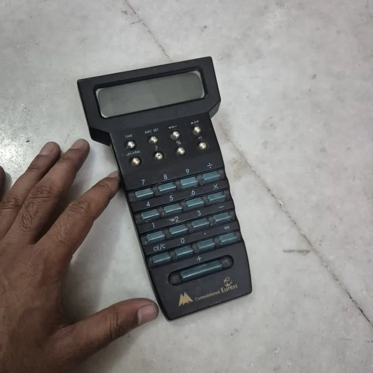 Consolidated Eurest Vintage Black Handheld Calculator — Office and Stationery prop for rent in Delhi NCR