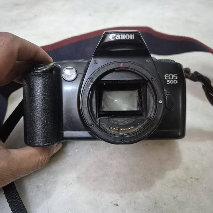 Vintage Black Canon EOS 500 SLR Film Camera Body with Strap — Tech and Electronics prop for rent in Delhi NCR