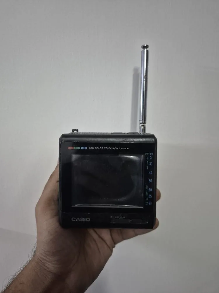 Vintage Black Casio TV 7500 Portable LCD Color Television with Antenna — Tech and Electronics prop for rent in Delhi NCR