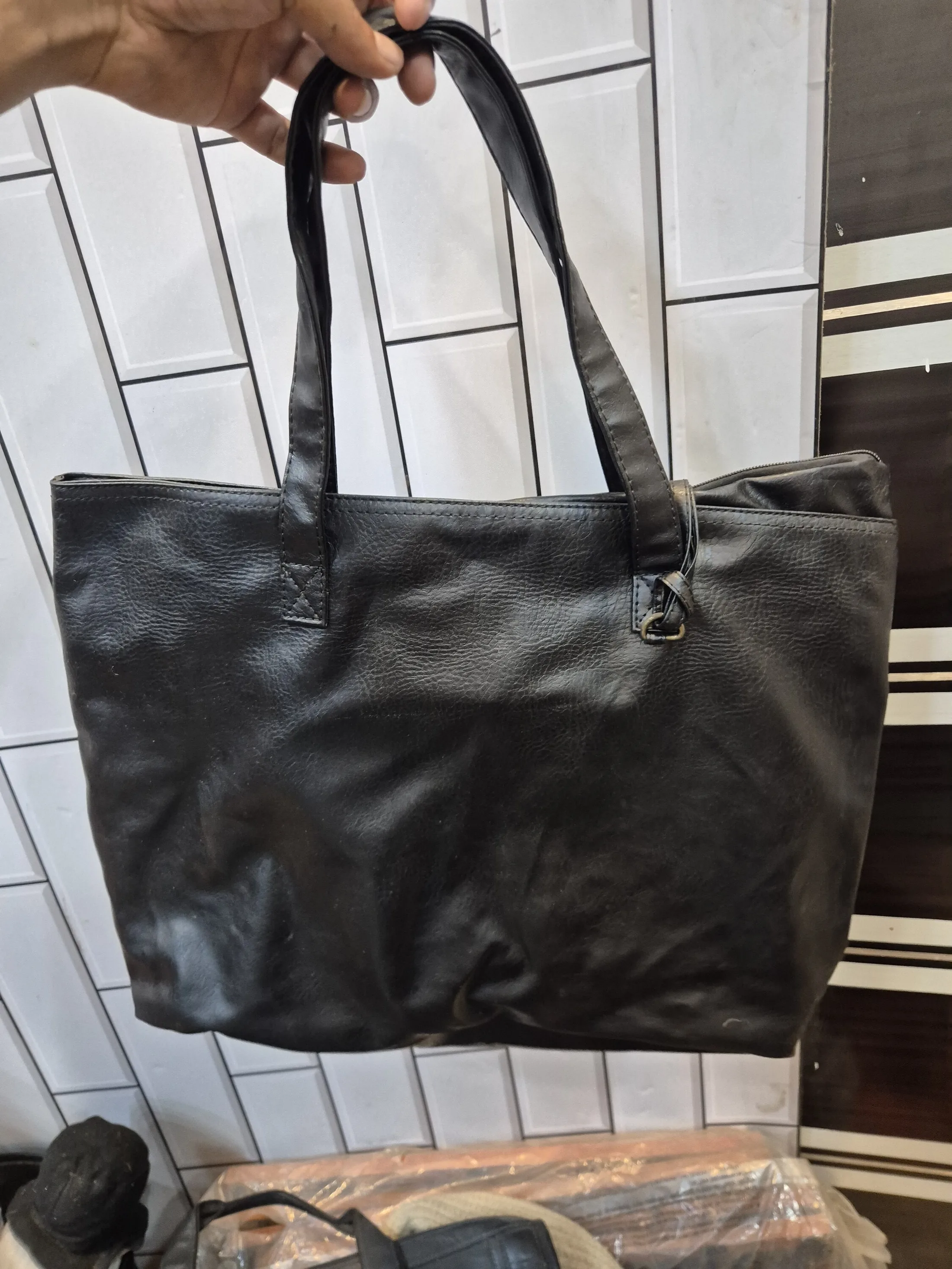Black Leather Tote Bag with Long Handles — Fashion and Accessories prop for rent in Delhi NCR