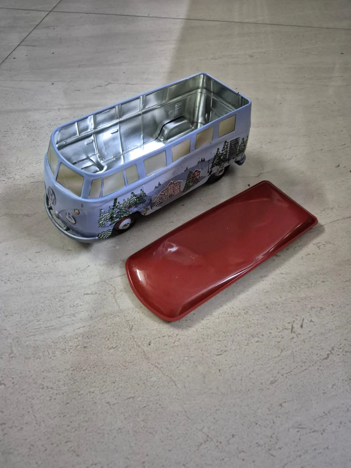 Vintage Tin VW Bus Christmas Print Storage Box with Red Lid — Toys and Games prop for rent in Delhi NCR