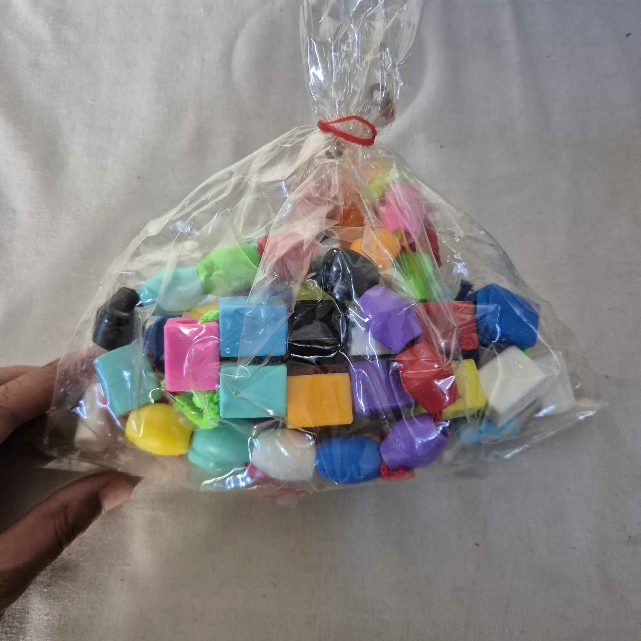 Multicolor Plastic Assorted Shape Toy Pieces Bag — Toys and Games prop for rent in Delhi NCR