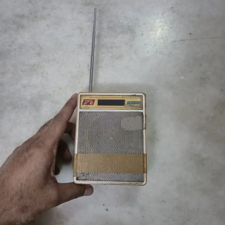 Vintage Cream FM Handheld Pocket Transistor Radio Antenna — Music and Sound prop for rent in Delhi NCR